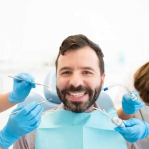 A patient verifying their Medi-Cal dental benefits at the Alta Vista Dental front desk in Vista, CA.