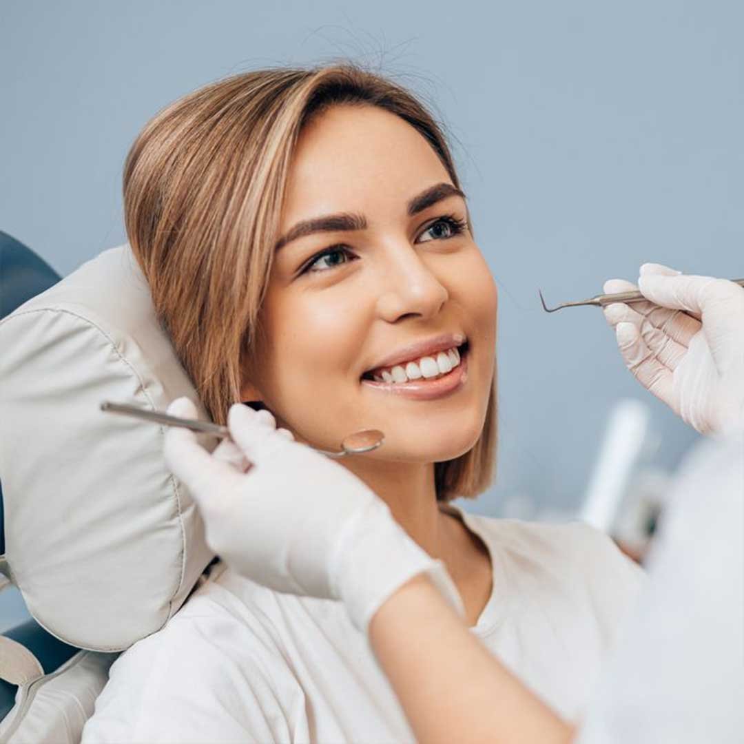 A patient using their Physicians Mutual dental insurance at Alta Vista Dental, a top-rated boutique dentist in Vista, CA.